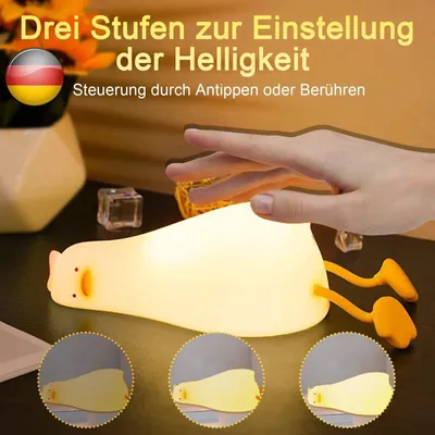 A hand is shown touching a glowing silicone duck-shaped night light, with three circular insets below showing different brightness levels.