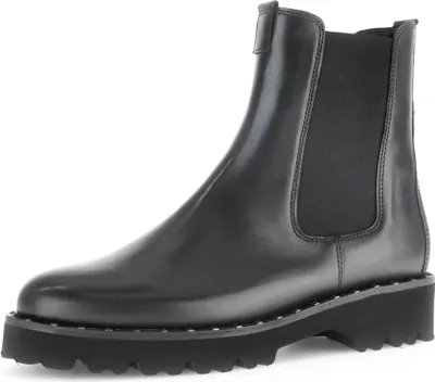 A single black Chelsea boot is shown against a white background.