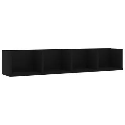 A black wall shelf with four compartments is shown against a white background.