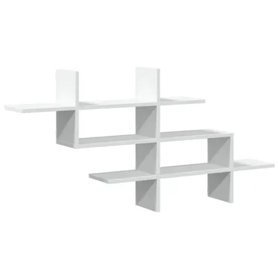 A white, modern, geometric wall shelf unit is displayed against a white background.