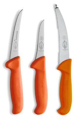 Three knives with orange handles are arranged diagonally on a white background.