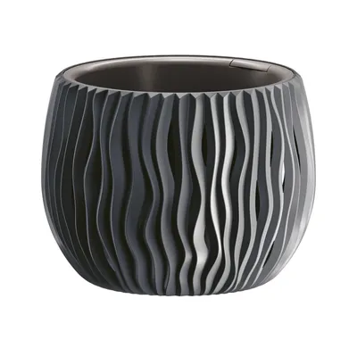 A dark gray, textured planter pot with a wavy, ribbed design.