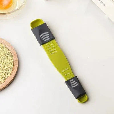 Immagine prodotto di Misurino da cucina con graduazione in grammi e millilitri, adatto per zucchero, latte in polvere, spezie ecc. Dotato di un sistema a cursore multiplo, facile da usare e da pulire