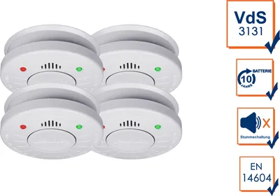 Four white smoke detectors are arranged in a group on a white background, with informational icons and text to the right.