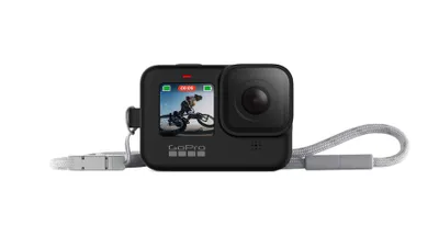 A black GoPro camera with a wrist strap attached, shown against a white background.