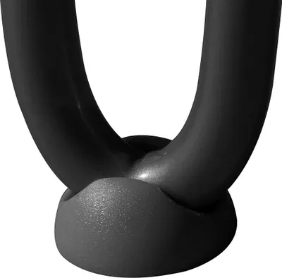 A close-up view of the base of two black hairpin table legs.