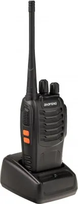 A black Baofeng BF-888S UHF walkie-talkie is shown in its black charging dock against a white background.