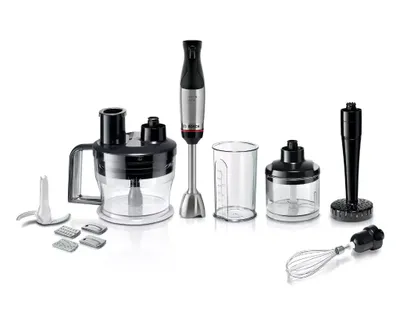 A collection of kitchen blender attachments and a hand blender on a white background.