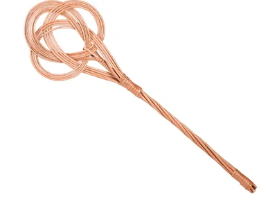 A woven carpet beater on a white background.