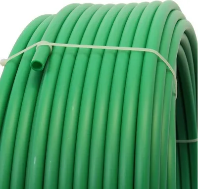 A coiled green plastic pipe secured with a white zip tie.