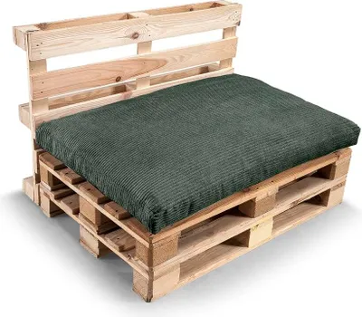 A pallet sofa with a green cushion and backrest.