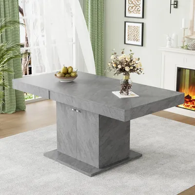 A dining table set in a well-lit room with a fireplace and curtains.