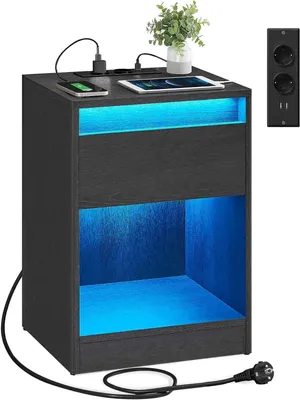 Imagen del producto de Mesita de noche con iluminación LED. Incluye enchufes y puertos USB. Dimensiones: 40 x 35 x 55 cm. Color: