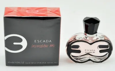 A perfume bottle and its box are displayed side-by-side on a white background.