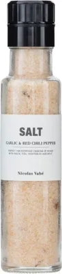 A clear, well-lit studio shot of a glass bottle filled with salt, with a black cap and a white label.