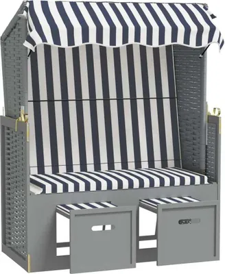 A beach chair with a striped canopy and seat.