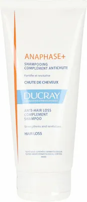 A white tube of shampoo with text and branding.
