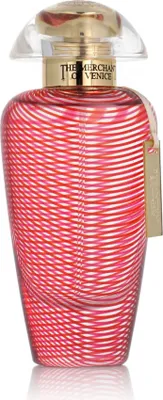 A perfume bottle with a red and white striped pattern.