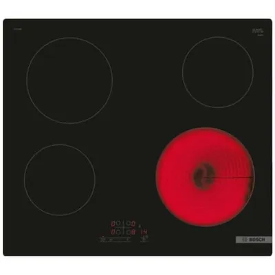 A black electric stovetop with four burners, one of which is glowing red.