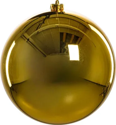 A close-up studio shot of a single gold Christmas ornament.