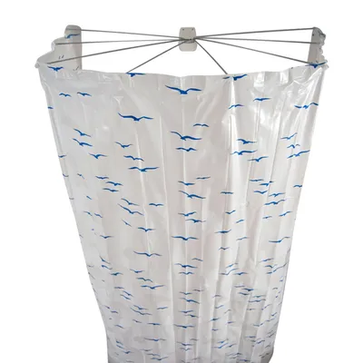A shower curtain with a bird pattern hanging from a shower rod.