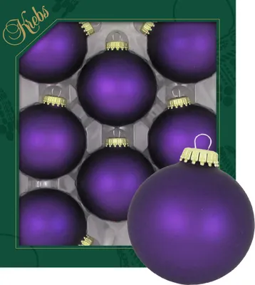 A set of purple Christmas ornaments in a box, with one ornament prominently displayed in the foreground.