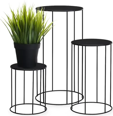 Three black metal plant stands of varying heights, with a potted artificial plant on the smallest stand.