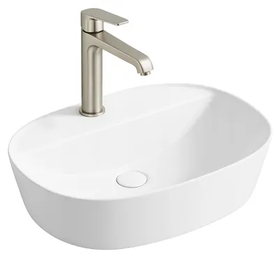 A white ceramic vessel sink with a brushed nickel faucet.