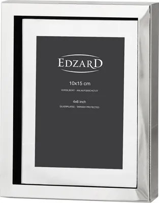 A silver picture frame with text on the matting.