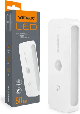 A product shot of a white LED night light and its packaging.