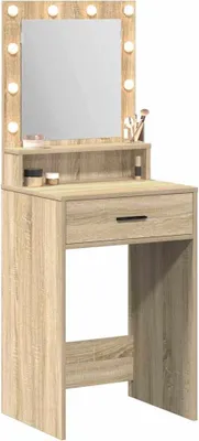 A makeup vanity table with a mirror and lights.