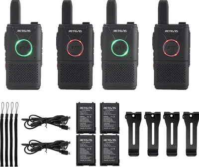 Four black walkie-talkies are arranged in a row at the top of the image, with accessories laid out below them.