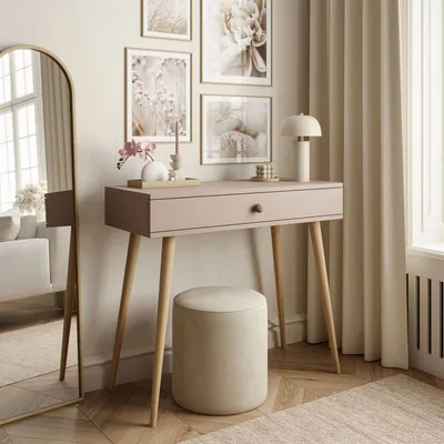 A console table with a drawer and a stool in a well-decorated room.