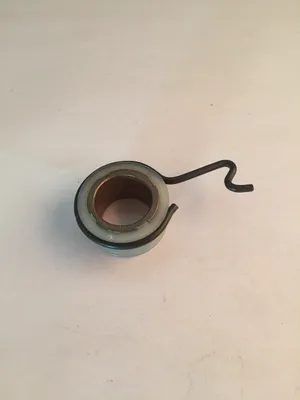 A single mechanical part, likely a spring or bearing assembly, is shown against a plain white background.