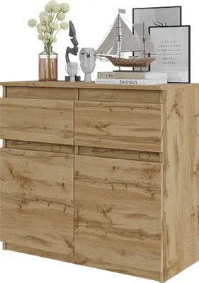 A wooden sideboard with decorative items on top.