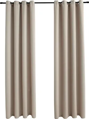 Two beige curtains hanging from a curtain rod against a white background.