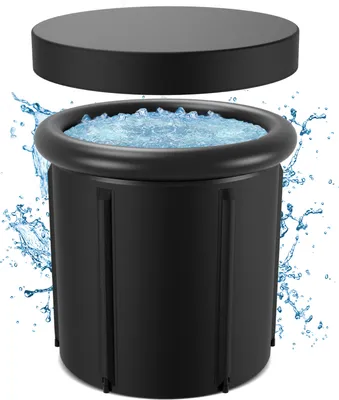 A black ice bath tub filled with water and ice, with a black lid hovering above it. Water splashes are visible around the tub.