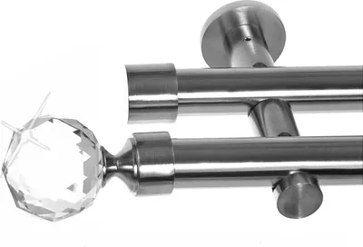 Close-up of a double curtain rod with a crystal ball finial.