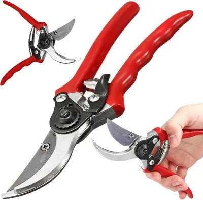A set of red-handled pruning shears is displayed against a white background, with one pair being held by a hand.