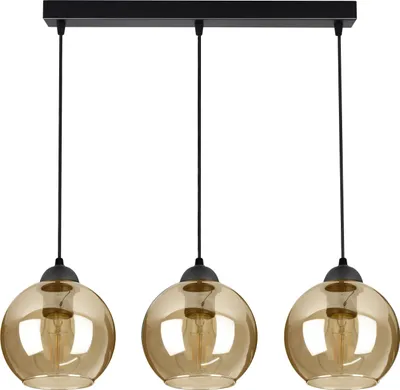 A black rectangular ceiling plate with three hanging pendant lights with amber glass globes.