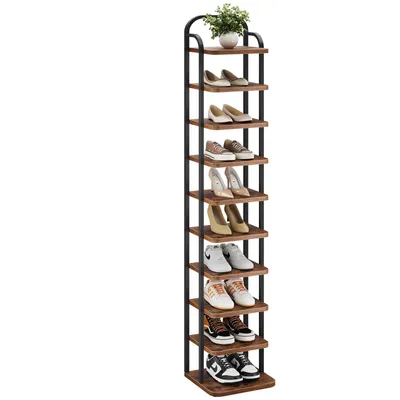 A tall, narrow shoe rack filled with various types of shoes and a small potted plant on the top shelf.