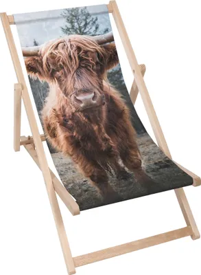 A wooden deck chair with a printed image of a Highland cow.