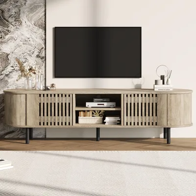 A TV stand with a TV on top, in a living room setting.