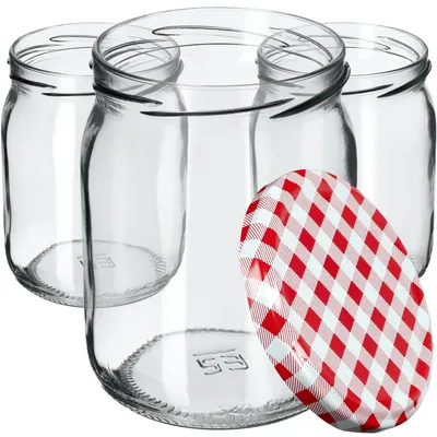 Several empty glass jars are arranged together, with one red and white checkered lid in the foreground.