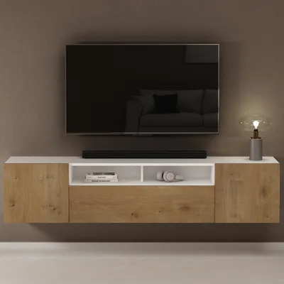 A modern TV lowboard with a television mounted above it.