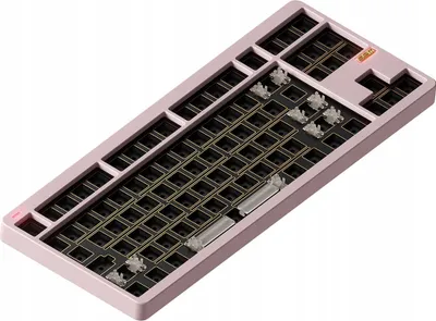 A barebone mechanical keyboard with a pink casing and black base, showing the hot-swap sockets and stabilizers.