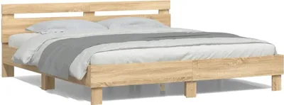 A wooden bed frame with bedding on a white background.