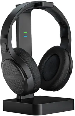 A black wireless headphone set with a charging stand.