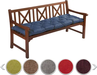 A wooden bench with a blue cushion on it, with color swatches below.