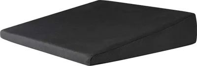 A black wedge cushion is shown from a diagonal angle against a white background.